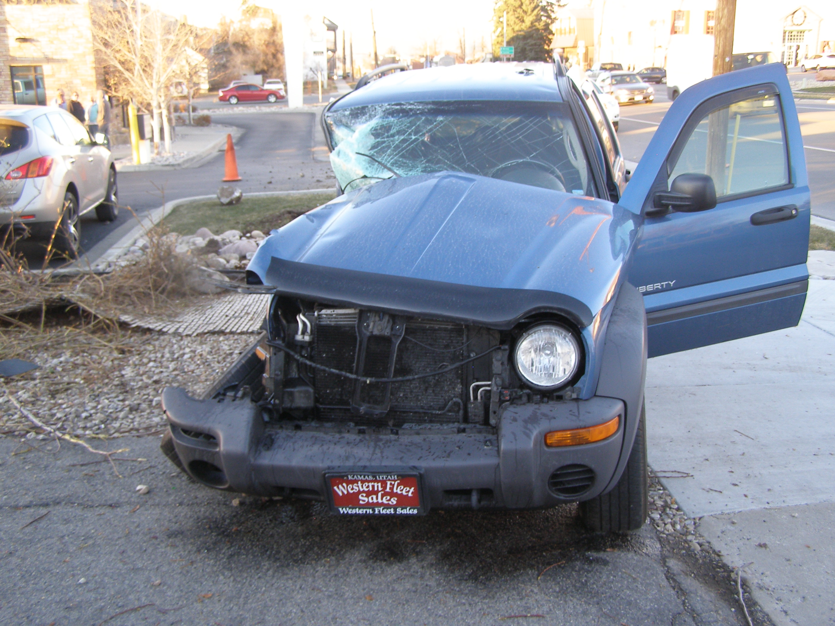 Injury/property damage crash involving a Jeep liberty and dump truck in