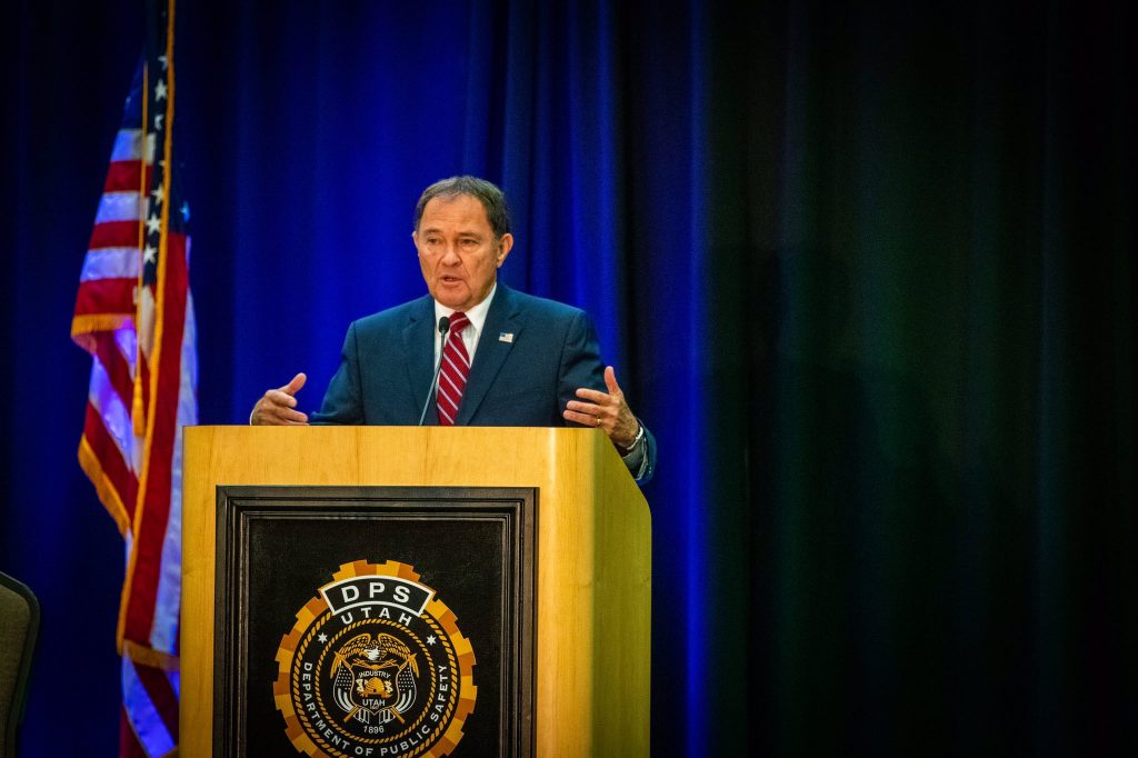 Governor Herbert speaks at the Safety Summit - standing at the podium.