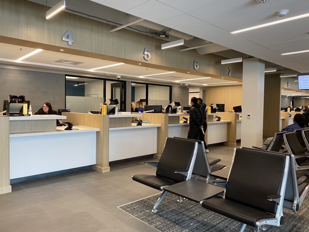 Driver license office with counters and waiting area.